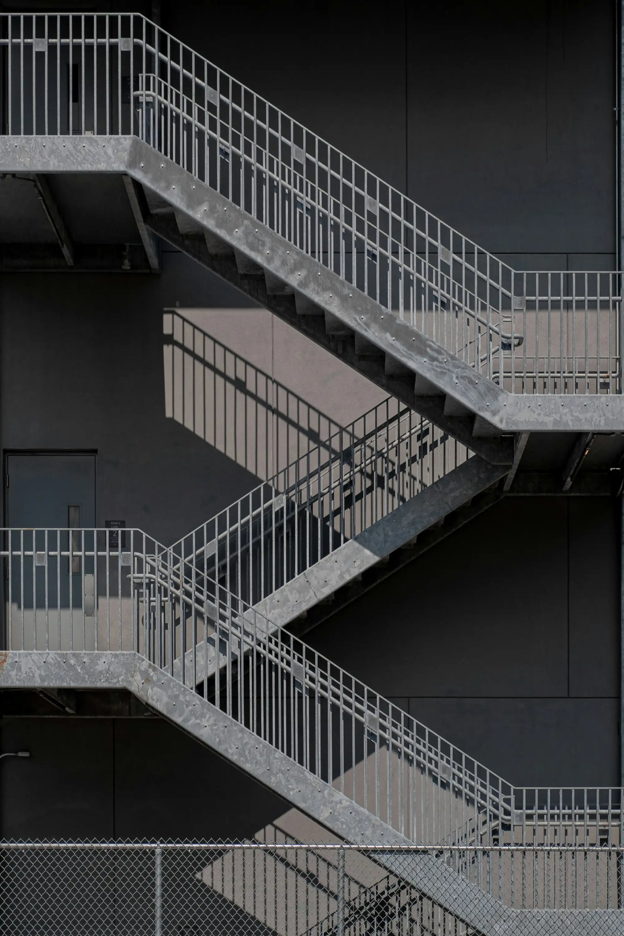 Commercial metal fabrication including railings, stairs, and security gates for DMV properties